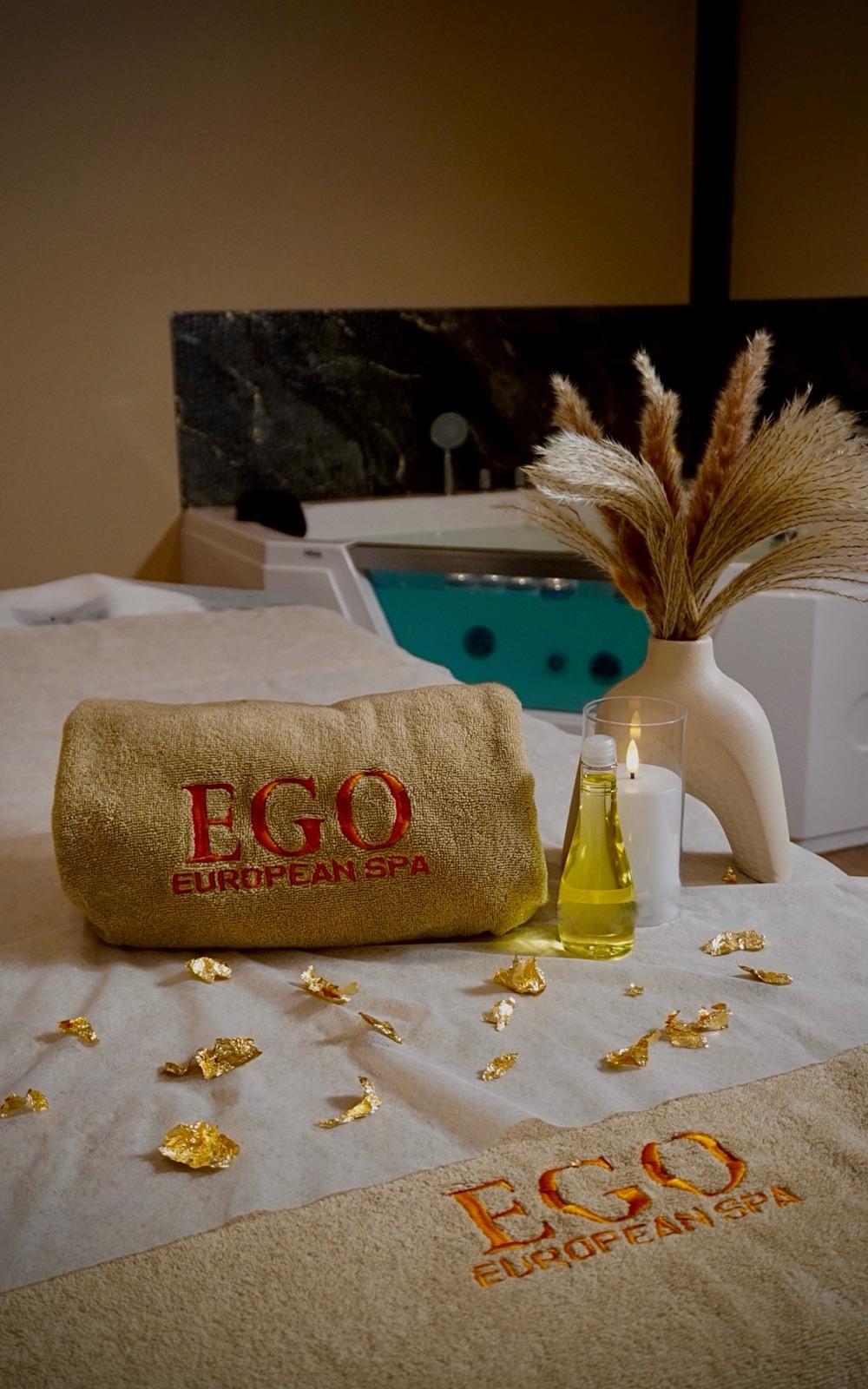 EGO towel and aroma oils beside the rose jacuzzi at Ego European Spa in Deira, Dubai