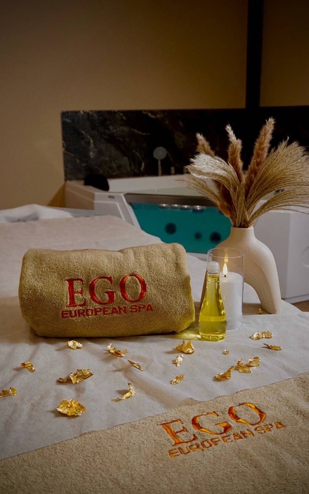 EGO towel and aroma oils beside the rose jacuzzi at Ego European Spa in Deira, Dubai